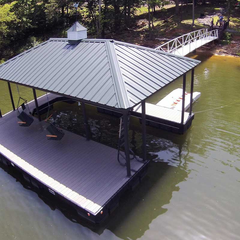 Large dock with swinging seats and boat slip