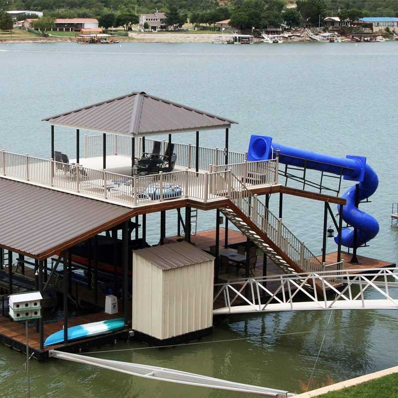 Large dock with blue slide and seating areas